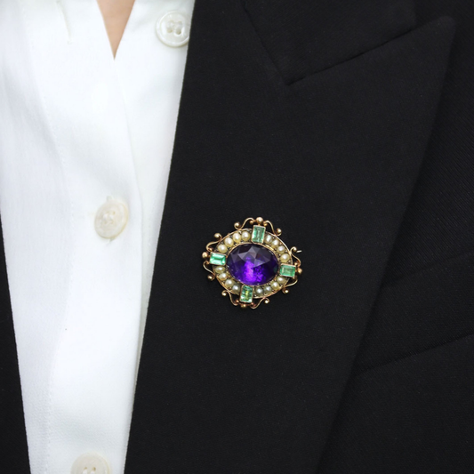 Carlo & Arthur Giuliano Antique Platinum & 18KT Yellow Gold Amethyst, Emerald & Natural Pearl Brooch worn on lapel