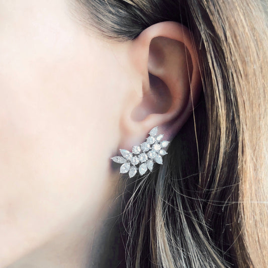 1960s Platinum Diamond Earrings on ear