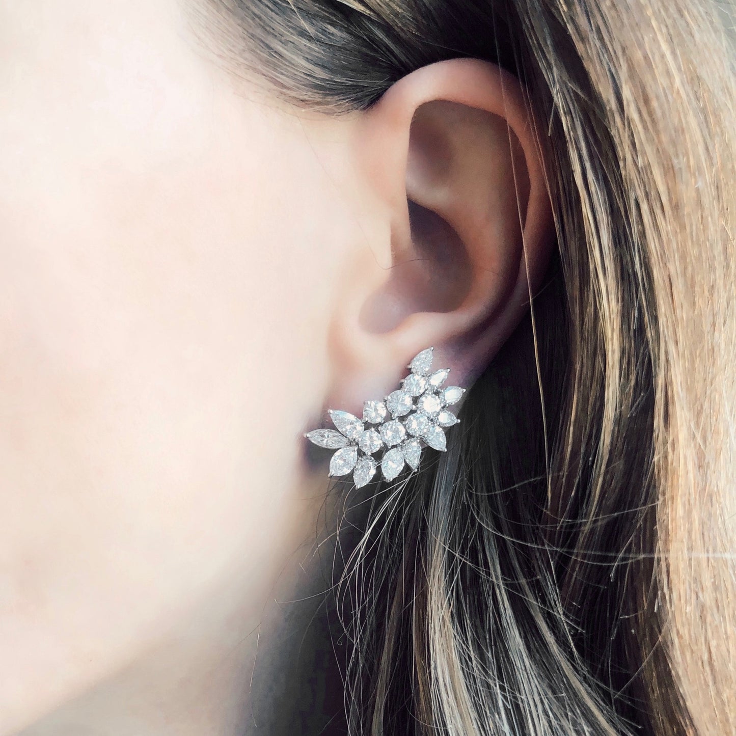 1960s Platinum Diamond Earrings on ear