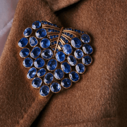 Rene Boivin 1930s 18KT Yellow Gold Sapphire Feuille Brooch on collar