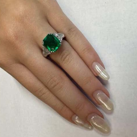 Andrew Clunn Post-1980s Platinum Emerald & Diamond Ring on finger