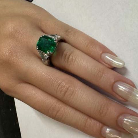 Andrew Clunn Post-1980s Platinum Emerald & Diamond Ring on finger