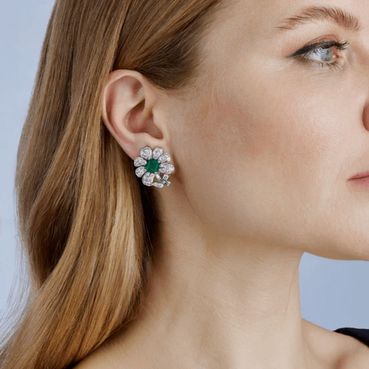 Gazdar 1950s Platinum Emerald & Diamond Flower Earrings on ear