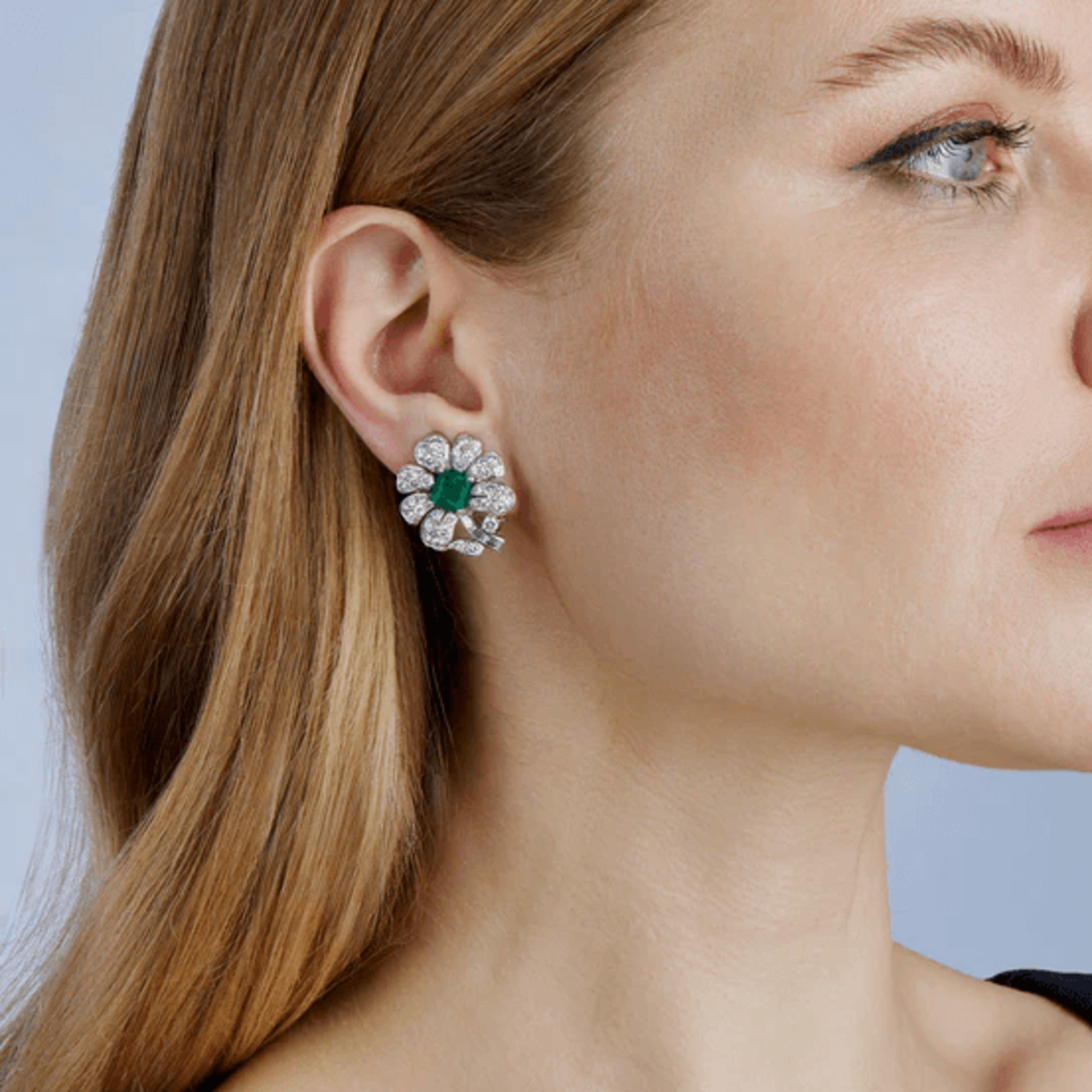 Gazdar 1950s Platinum Emerald & Diamond Flower Earrings on ear